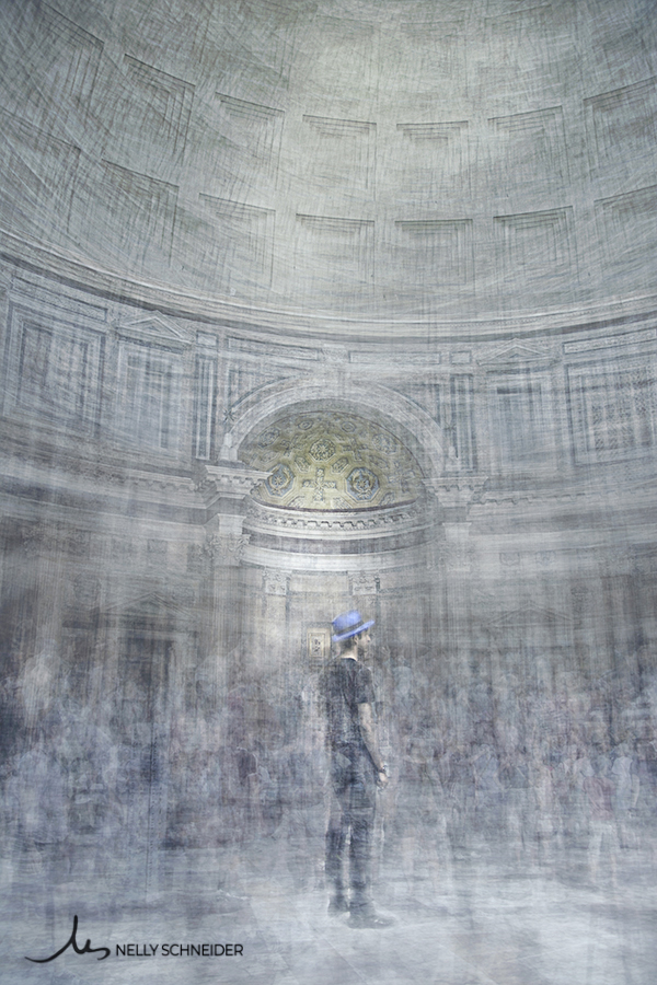 a man wearing a black t-shirt and a blue hat is standing in the middle of the pantheon church in rome